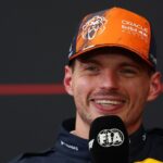 Max Verstappen smiles during the press conference after qualifying for the 2026 Belgian Grand Prix at Spa-Francorchamps.