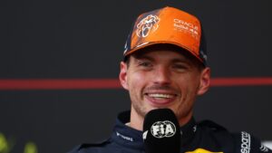 Max Verstappen smiles during the press conference after qualifying for the 2026 Belgian Grand Prix at Spa-Francorchamps.